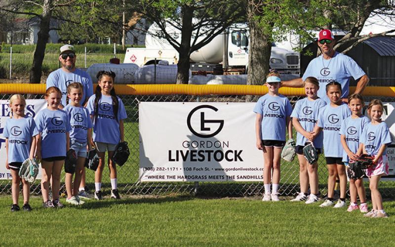 Courtesy Photo 2024 Gordon Livestock Gordon Pixies Softball. Players: (L-R) Brookley Peters, Saedy Rosane, Emerson Banks, Elliana American Horse, Astrid Ray, Aryanna Saxton, Allie Mills, Brogan Marcy, and Bryce Marcy. Coaches are Brad Marcy and Tyler Banks.