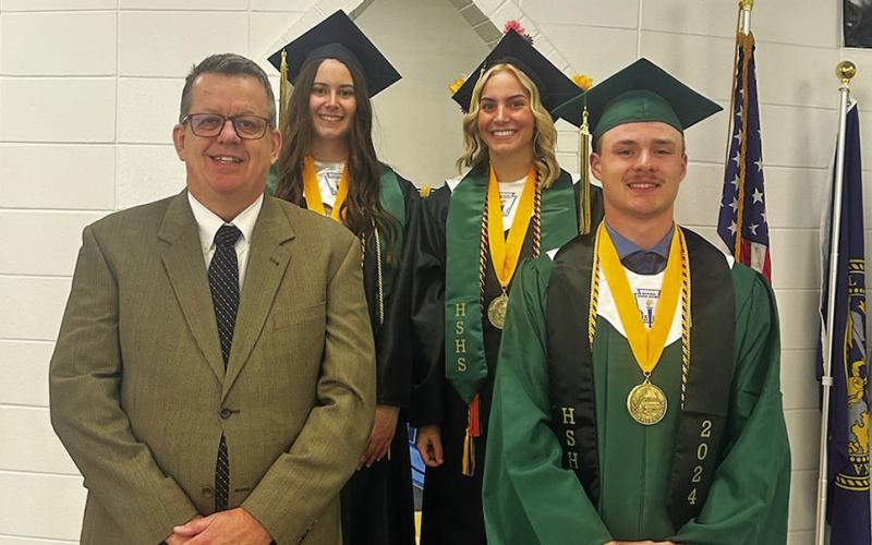 Photo by Tera Digmann Hay Springs presented 19 graduates for commencement on Saturday, May 11. The Hawks also had three valedictorians. Pictured are: (L-R) Hay Springs Superintendent George Clear, Abigail Russell, Gabrielle Twarling, and Jordyn Anderson.