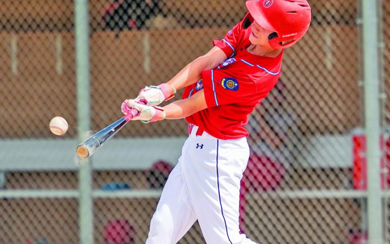 Photo by Marlee Keracik Freshman Joey Ziller rips a double against Valentine during the Chadron Juniors Wood Bat Tournament on Sunday, June 29.