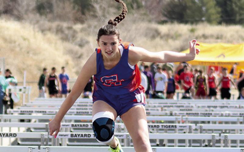 Photo by Scott Bidroski Sophomore Claire Wellnitz races to the finish in the 100 Meter Hurdles during the Bayard CD Invitational on March 28.