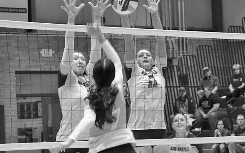 Photo by Michele Heck Junior Stormy Tesch and senior Taleigh Starr go up for the block against Valentine on Thursday, October 9. The Badgers would get the win though, 3-0.