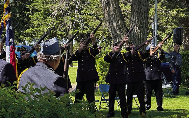 Photo by Heidi Beguin The Color Guard from Rushville Post #161 fires off a 21gun salute for the Memorial Day services at the Rushville Cemetery.