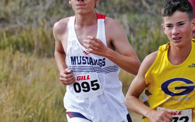 Photo by Chris Heiser Sophomore Draegon Leonard digs deep in the 5K race at Chadron State College on Friday, September 13.
