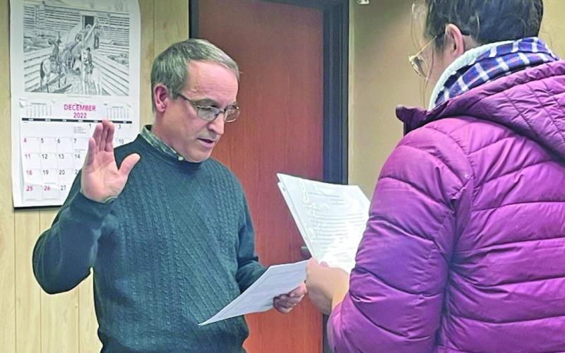 Journal Star Photo Glenn Muhr, pictured above being sworn in as Hay Springs Mayor on Monday, December 19, 2022, has officially resigned. Keith Kearns was chosen as an interim replacement following the official resignation date of April 1, 2024.
