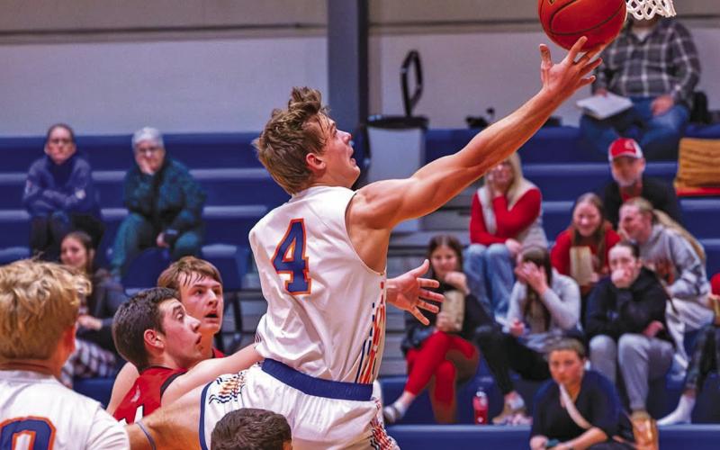 (Photo by Richae Malara) Senior Daniel Martins goes through the Ainsworth defenders for a lay-up on Saturday, December 6. Martins led the Mustangs with 26 points in the winning effort.