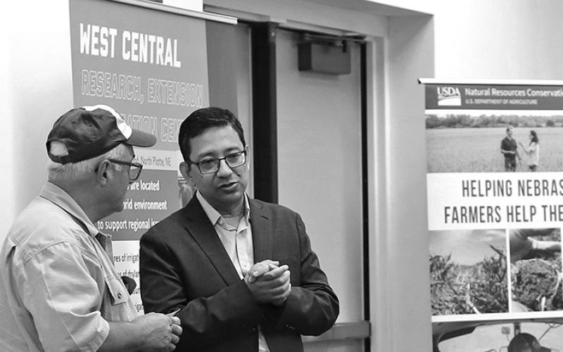 Photo by Nicole Heldt Bijesh Maharjan, right, Nebraska Extension soil nutrient and management specialist, speaks to an attendee at the second Soil Health School at the West Central Research Extension and Education Center in North Platte.