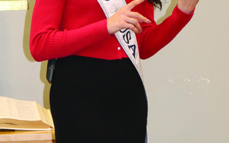(Photo by Scott Bidroski) Miss USA Audrey Eckert speaks to a crowd on Friday, December 26.