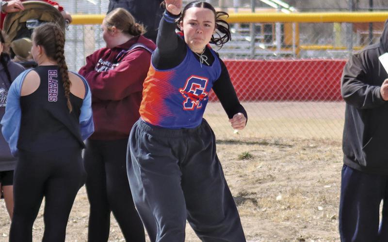 (Photo by Scott Bidroski) Senior Rowan Simonson heaves the shot during the Binfield Invite on Friday, March 27. Simonson finished third in the event.