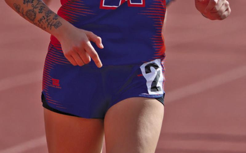 (Photo by Scott Bidroski) Junior Rarity Cournoyer paces herself to the win in the 3200 meter race. Cournoyer picked up two golds for her efforts on the day.