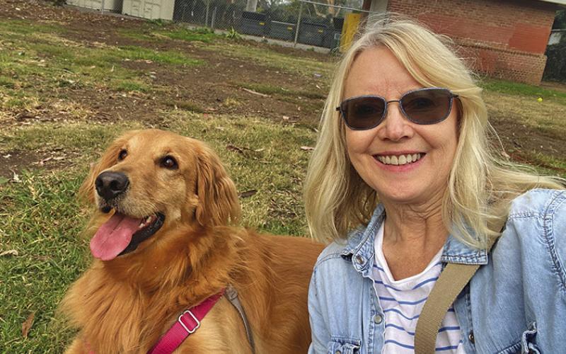 (Courtesy Photo) Lori Selna is pictured with her dog Luna who she almost had to rescue from the fire that burned her home to the ground.