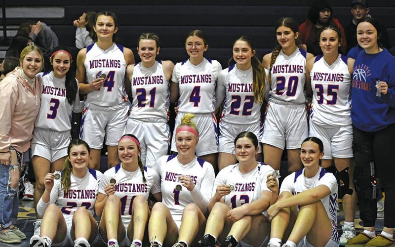 Photo by Melissa Grover The Gordon-Rushville Girls Basketball team poses for a team photo with their third place medals following the win over Morrill to clinch that finish.