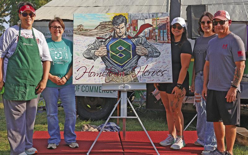 (Courtesy Photo) Members of the Security First Bank staff accepted this one of a kind painting done by local artist, Autumn Mangione. Those included in the photo are: (L-R) Sherry Erman, Amanda Haller, Morgan Weyers, Melissa Jancik, and Dave Galyen.