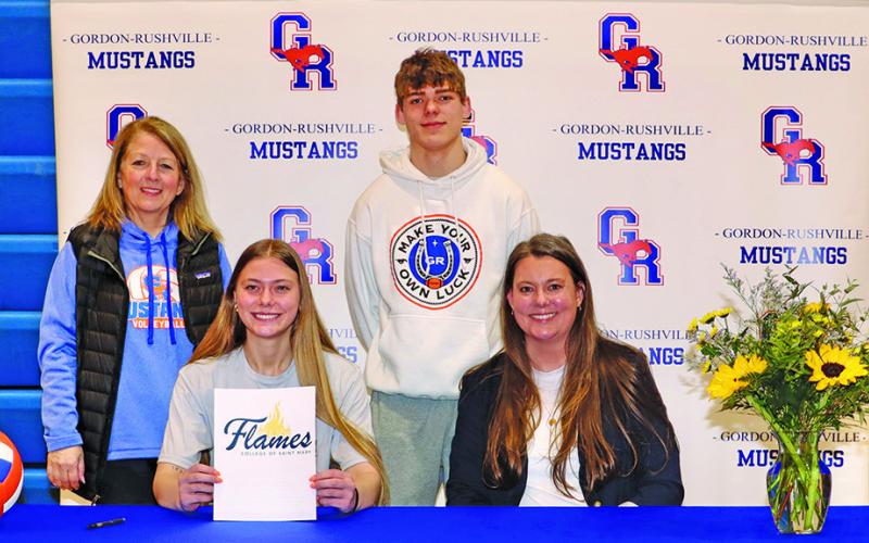 Photo by Scott Bidroski Gordon-Rushville senior Emma Martins signed her letter of intent to play collegiate volleyball at the College of St. Mary’s on Tuesday, March 11. Martins is joined by Gordon-Rushville Volleyball Coach Kim Campbell, her brother Daniel Martins, and mother Ashley Martins in the photo.