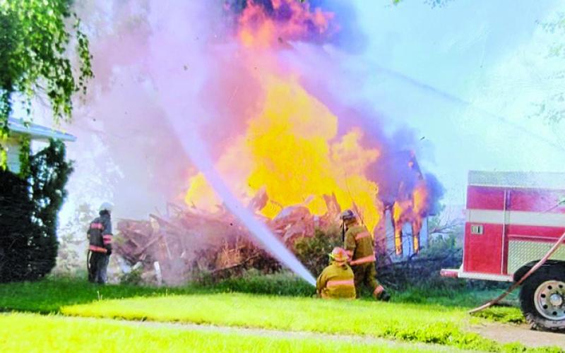 Courtesy Photo “The dragon is real.” Kearns, who is on the right side of this photo, characterizes fire as a dragon. And in this photo, it shows it’s true colors.