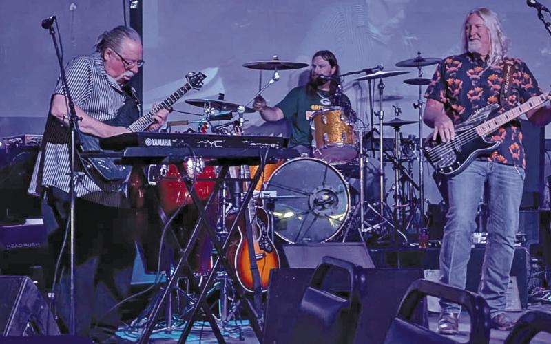 (Courtesy Photo) George Meng (left) shreds on the guitar along with Karsten and John Victory during a performance at the the 2025 Nebraska Music Hall of Fame event in Omaha, Neb.