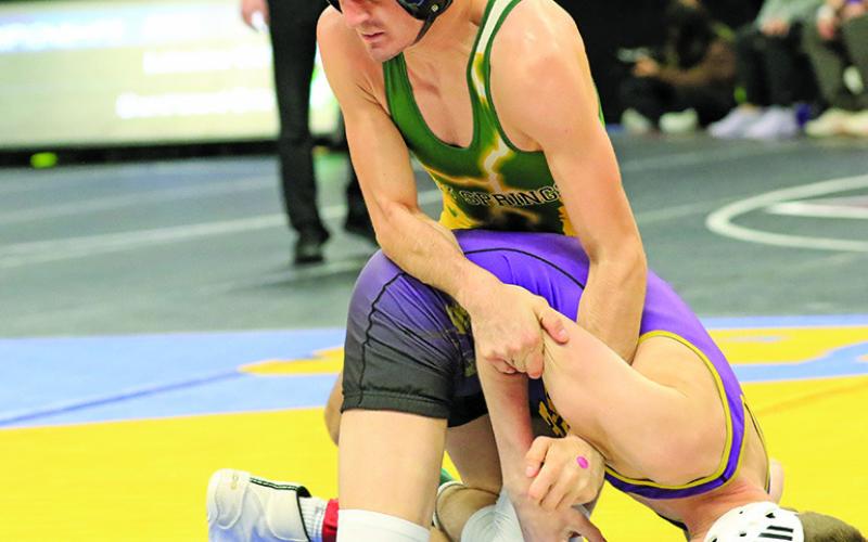 Photo by Jeremy Buss Photography Senior Jarhett Anderson rolls his opponent during the match in the opening round on Thursday, February 15.