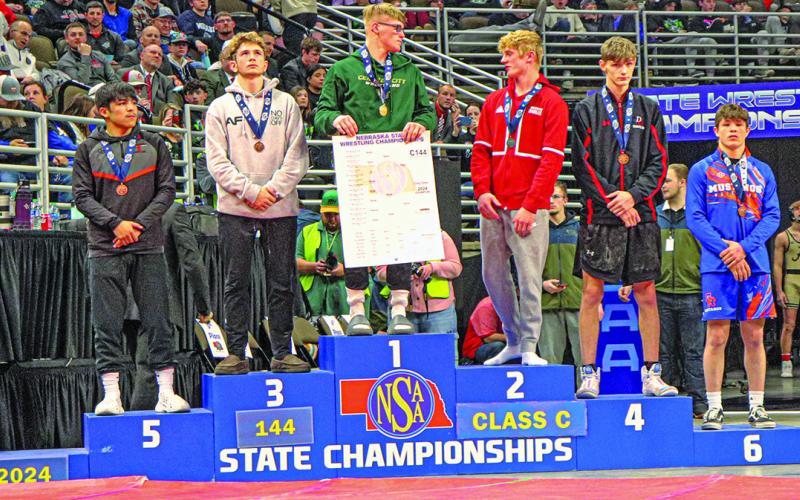 Photo by Blake Peterson Gordon-Rushville’s Kyler Vincent stands on the podium and took home a sixth place medal from the 2024 NSAA State Wrestling Tournament. Vincent is now a two-time medalist.