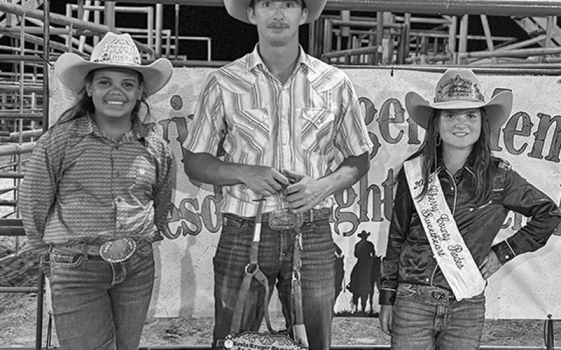 Photo by Courtney Ostrander The Hard Luck Award went to Seth Livermont. Here he is pictured with that award and Sheridan County Princess Kamille Kruger (left) and Cherry County Sweetheart Ava Rahn (right).