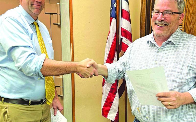Photo by Samantha Orr Longtime Hay Springs Council member Keith Kearns (right) was appointed as Mayor during the April 9 meeting. Swearing in Mayor Kearns was Hay Springs City Attorney Dan Skavdahl (left).