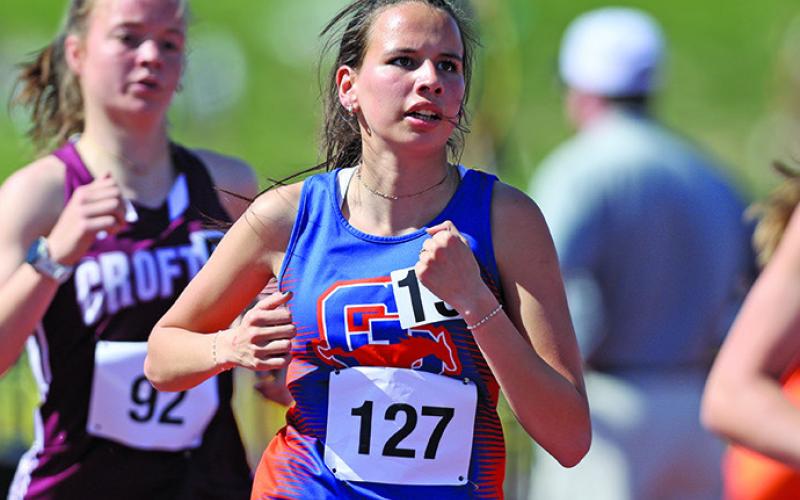 Photo by Jeremy Buss, Jeremy Buss Photography Senior Tyrah American Horse keeps her eye on the time during the 1600 meter race at the Nebraska State Track Meet on Saturday, May 18. American Horse would earn a medal with a record breaking time of 5:30.03.