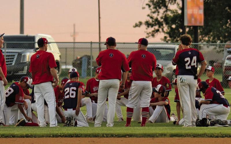 Photo by Megan Heiting The team meets following a win at Modisett Ball Park during the 2024 season. The Security First Regulators finished their season with a 8-31 overall record.