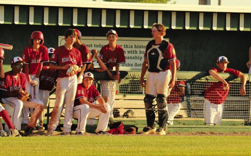 Photo by Megan Heiting The Security First Regulators look on from the dugout during a contest at Modisett Ball Park during the 2024 season.