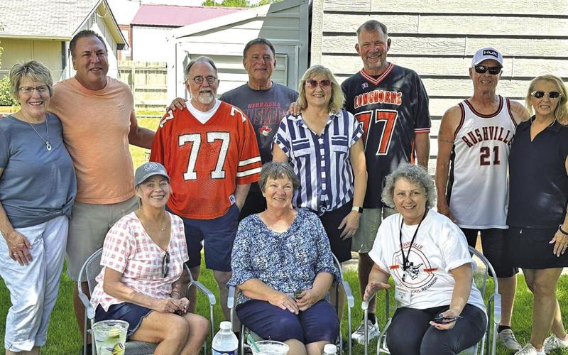 Photo by Heidi Beguin The Class of ‘77 gathered Saturday morning before the parade to prepare their float at the home of Marty and Karmen Palmer. After singing the RHS Fight Song, the group posed for a photo.