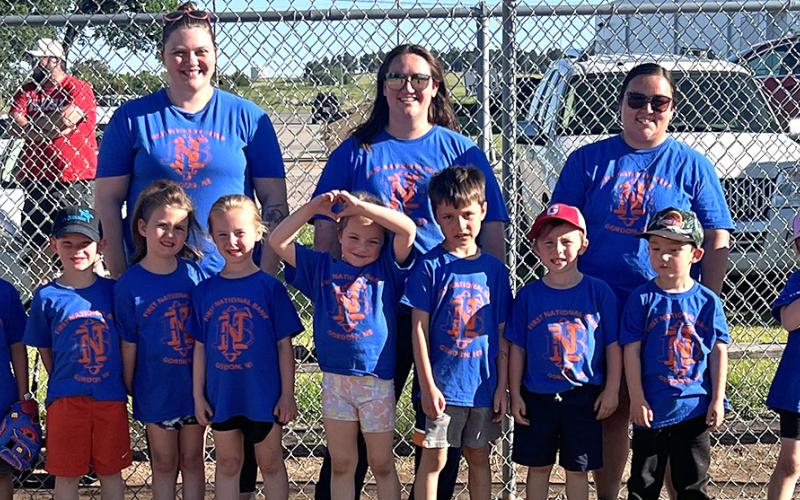 First National Bank Gordon T-Ball Team. Front row: (L-R) Patrick Montenez-Rodriguez, Connor Peters, Presley Wolkins, Lil Takubov, Milo Wolkins, Dean Child, Gage Puncochar. Back row: (L-R) Coaches Angela Clark, Shelby Reynolds, and Courtney Puncochar. Courtesy Photo