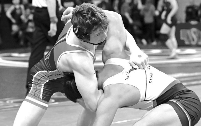 Photo by Jeremy Buss Photography Junior Kyler Vincent wrestles Chase County’s Luis Co in the fifth place match at the NSAA