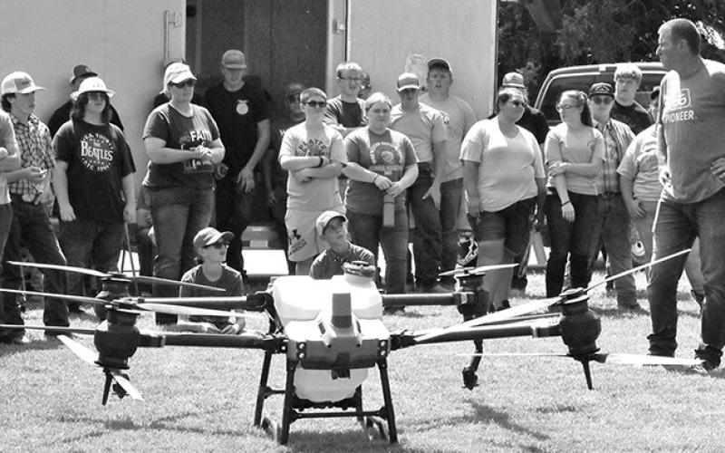 Photo by Chabella Guzman Dan Fitts, far right, farmer and drone operator, gives a talk and demonstration during the 2023 PARTT event in August at the UNL Panhandle Research Extension and Education Center in Scottsbluff.