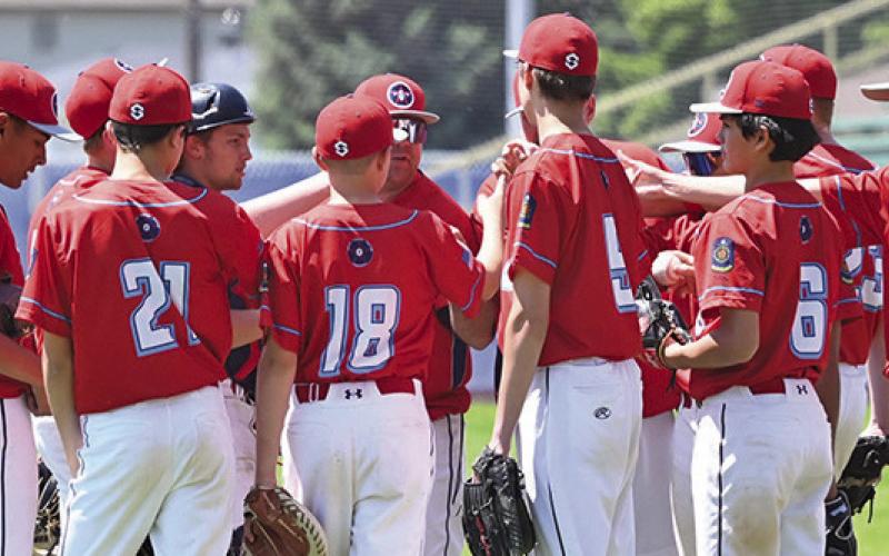 (Photo by Richae Malara) The Security First Regulator Juniors team huddles up after an inning during the Gering Legion Tournament played on June 6, 7, 8.