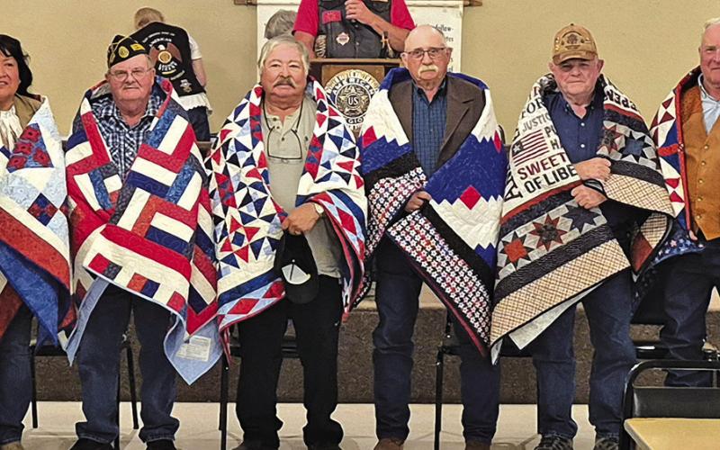Photo by Kathy Dye On Saturday, October 12, six Veterans were honored with a Quilt of Valor for their service in the military branches. Those honored on the day were: (L-R) Lynette Kills Black, Jim Landreth, Fred Cano, David Roth, Jack Bermingham, and Jerry Janssen.