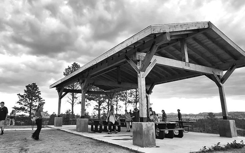 Photo by Justin Haag, Nebraskaland Magazine/NGPC Visitors enjoy the new Pinecone Shelter, one of the recent improvements at Chadron State Park.
