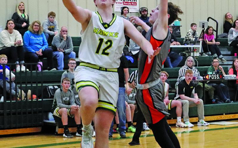 Photo by Scott Bidroski Junior Hunter McDonald goes up for two against Cody-Kilgore. McDonald finished the contest with 19 points in the Hay Springs win.