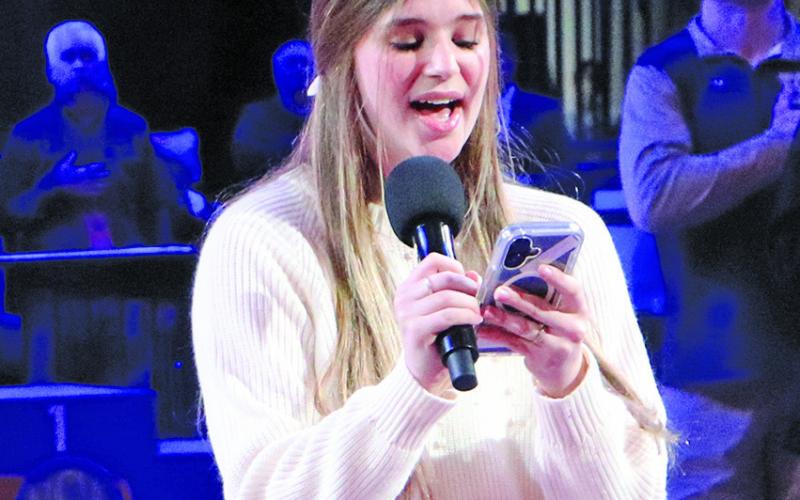 (Photo by Blake Peterson) GRHS junior Amara Funk was chosen to sing the National Anthem Saturday at the NSAA State Wrestling Tournament.