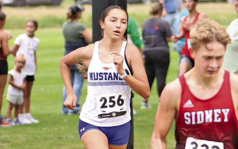 (Photo by Scott Bidroski) As cool as the other side of the pillow. Junior Rarity Cournoyer outpaced the competition during the Panhandle Classic, finishing in first place and setting a new school record with a time of 19:21.