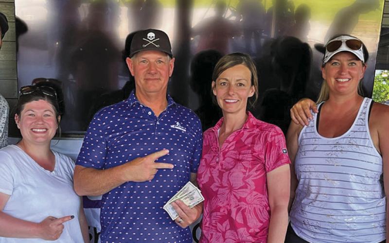(Courtesy Photo) The winners from the Couples Division. Kyle and Jacoby Anderson (left) finished in first place.