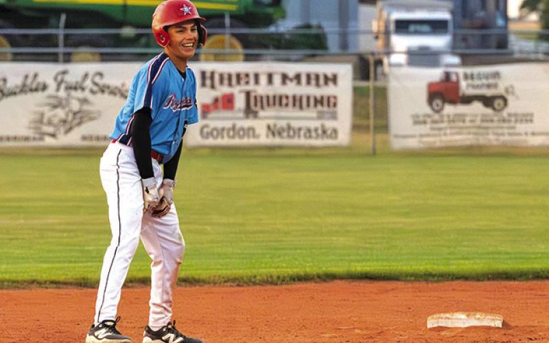 (Photo by Richae Malara) Freshman Kendall Lebeau is all smiles after reaching second base on a double. Lebeau finished the game with 3 hits in the 14-2 win.