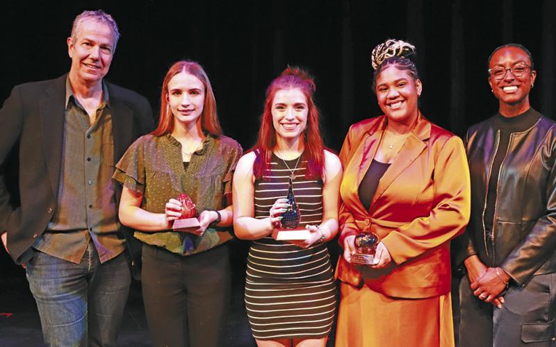 (Photo Courtesy of the Nebraska Arts Council) The top three finishers in the Nebraska State Poetry Out Loud competition take a photo following the awards presentation. Gordon-Rushville High School junior Lainey Fillmore is in the center holding the first place trophy. Joining her for the photo include: (L-R) Nebraska State Poet Emeritus Matt Mason, Mieke van der Walt, Fillmore, MajieAhna Winfrey, and Nebraska State Poet Jewel Rodgers.