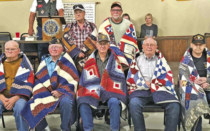 Courtesy Photo During a ceremony held at the Gordon American Legion Post #34 on Sunday, June 29, seven men were honored for their service in the military by receiving a Quilt of Valor. Those Veterans included: Back row (L-R) William Bell (Air Force) and Howard Link (Army). Front row (L-R) Rod Furman (Army), George Vandeveer (Navy), Keith Dorsey (Army), Fred Hlava (Army), and Tom Tuchek (Army).