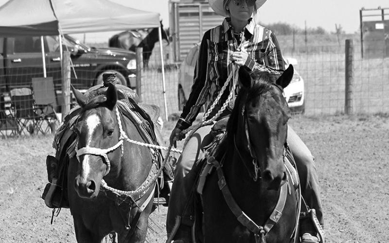 Photo by Heidi Beguin Charmayne Strong leads the ‘riderless horse’ symbolizing the passing of Angie Hoagland.