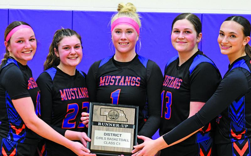 Photo by Melissa Grover The five Mustang seniors show off the hardware as District Runner-up following their hard fought loss to Bridgeport. Those seniors include: (L-R) Haley Johnson, Lillee Schmidt, Trinity Taylor, McKinley Grover, and Skye Tausan.
