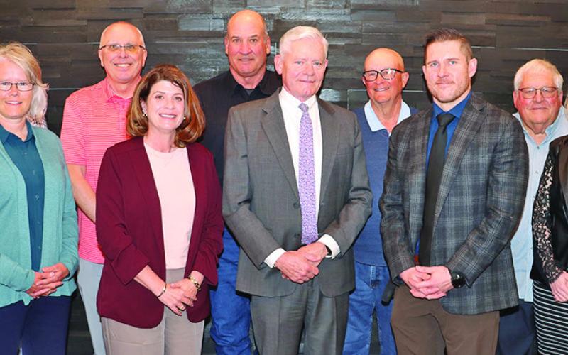 (Photo by Scott Bidroski) The First National Bank of Gordon Board of Directors takes a photo during their March meeting. Will Isham, center, is transitioning from his role as President of the bank into retirement but will still lead the Board of Directors. Pictured include: Randy Schmidt, Anita Brewer, Randy Langemeier, Brooke Gates, Troy Roth, Isham, Pat Riggleman, Cornelius Ray, Jim Smith, and Lacey Swayne.