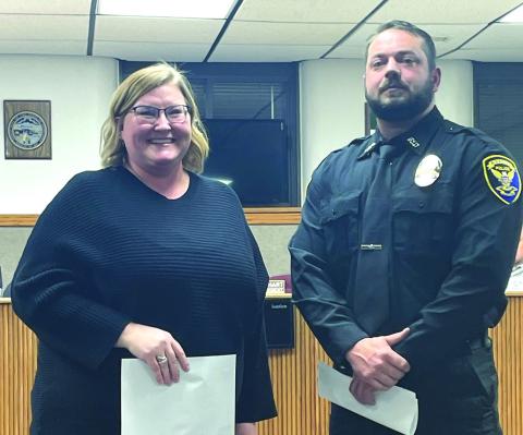 (Courtesy Photo) Gordon City Council President Alyssa DeHart (left) smiles after swearing in the newest officer to the Gordon Police Department, Tyler Mullanix, during the December 18 meeting.