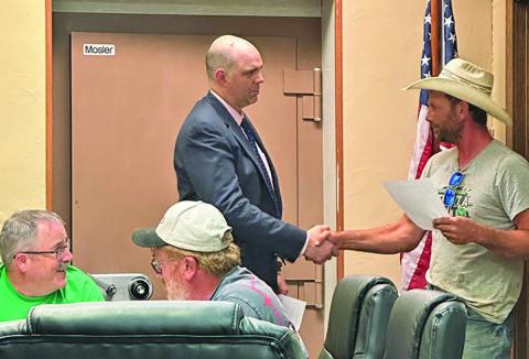 Photo by Heidi Beguin Mayor Keith Kearns watches as Brant Buettner is sworn into office by Hay Springs City Attorney Dan Skavdahl. Read the full story by Heidi Beguin on Page 4!