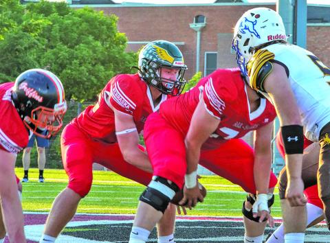 (Photo by Shontell Roseberry) Hay Springs graduate Dylan Young is under center for the Nebraska 6-Man All Star team. Young and the All Stars took on Wyoming in the annual showdown and brought home the win, 68-28. Young scored three touchdowns.