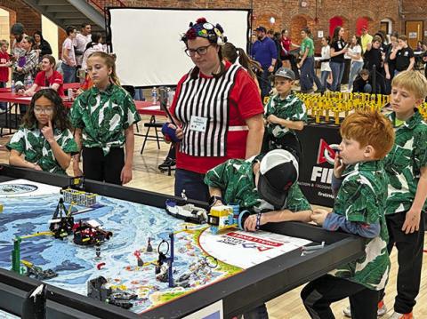 (Photo by Melissa Mracek) The Wild Robots from Rushville compete during the FIRST LEGO League Championships in Lincoln, Neb. on Saturday, March 22.