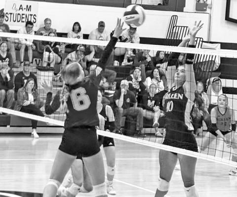 Photo by Jim Varvel Junior Reese Varvel sends a shot at the Mullen block during the Anselmo-Merna High School Invite this past weekend. The hawks finished their day with a 2-1 record.