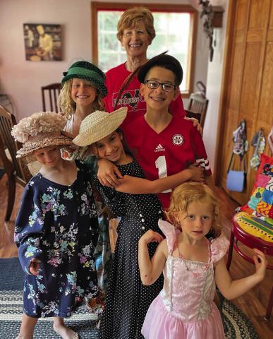 Courtesy Photo Sherry Retzlaff, pictured here with her grandchildren, has been selected for the Good Neighbor Award by the Sheridan County Ag Society.
