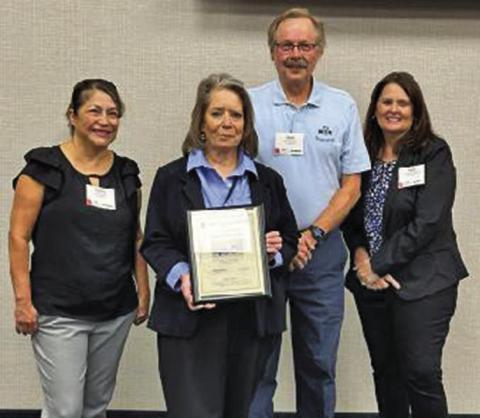 Courtesy Photo Jonnie Kusek, holding the award, receives recognition for her and her staff’s efforts in providing transportation services in Sheridan County in 2022. The 164% increase of ridership in 2022 was the highest increase among rural Nebraska public transit systems.